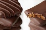 Crunchy pecan toffee infused with 15mg Delta‑9 THC, topped with roasted pecans and crafted with real butter